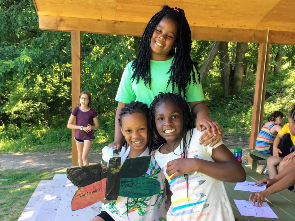 Campers showing off their bio-inspired water rocket design