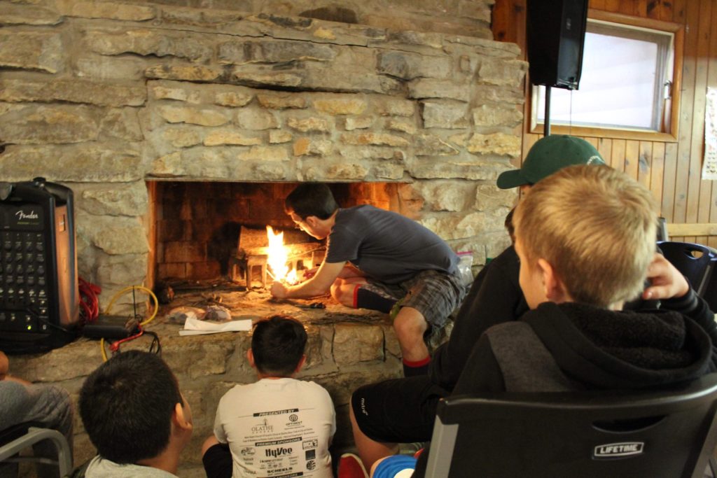 Volunteer counselor, David, built a fire for his cabin