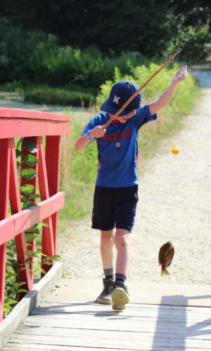 Among other activities, Wildwood campers learn to fish!